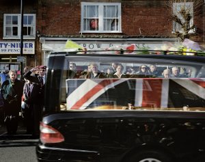 © John Angerson Swindon The town of Royal Wotton Bassett gained royal patronage in March 2011 by Her Majesty Queen Elizabeth II in recognition of its role in the regular repatriation of fallen servicemen and women from the wars in Iraq and Afghanistan. The bodies were transported from RAF Lyneham and pass through the town on their way to the coroner in Oxford. Family members, friends and the local community assemble along the route in silent tribute for Sgt. Paul Fox, Riflemen Martin Kinggett, Carlo Apolis and Senior Aircraftman Luke Southgate, who all died within six days of each other.